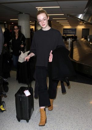 Elle Fanning in Black outfit at LAX Airport in LA
