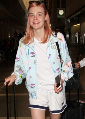 Elle Fanning in Shorts at LAX Airport in Los Angeles