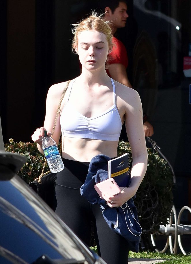 Elle Fanning in Spandex and Sports Bra at a gym in Studio City
