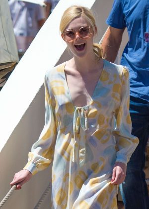 Elle Fanning in yellow maxi dress out in Cannes