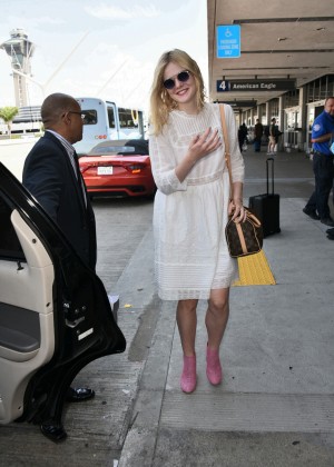 Elle Fanning in White Dress at LAX airport in LA