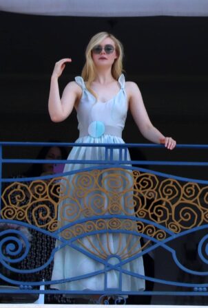 Elle Fanning - Spotted at the balcony of her hotel room in Cannes