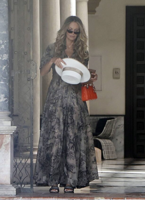 Elle Macpherson - Departing her hotel in Seville