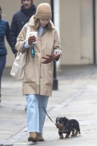 Emilia Clarke - Takes her dog for a stroll in London