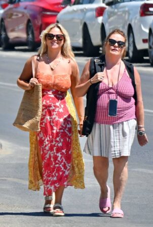 Emily Atack - In orange floral maxi dress wit her mother Kate Robbins on ho...
