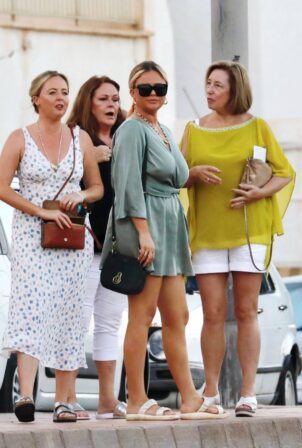 Emily Atack - Wearing a blue playsuit during holiday in Marbella