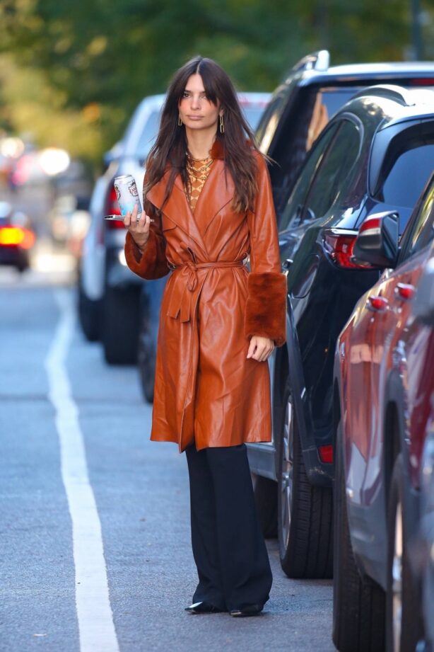 Emily Ratajkowski - In a long brown leather overcoat in New York