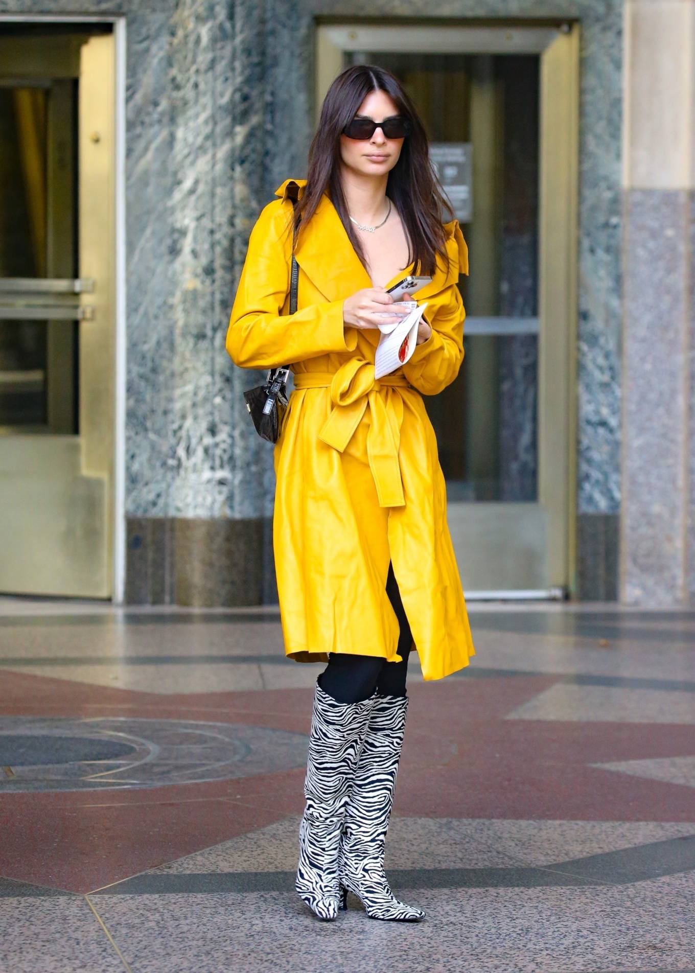 Emily Ratajkowski - In a yellow coat and zebra-striped boots in New York
