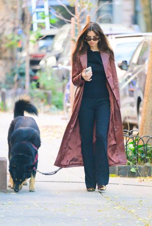 Emily Ratajkowski - Rocks in a burgundy leather coat while out for a walk in New York