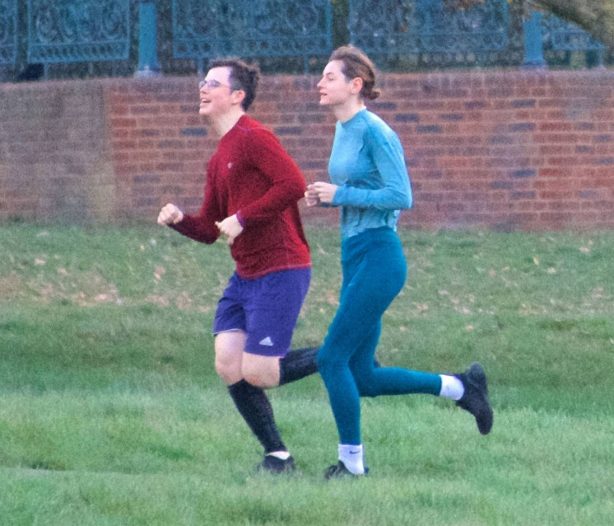 Emma Corrin - Jogging candids at a park with a mystery male friend in London