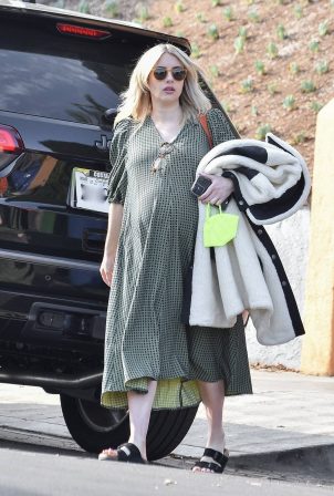 Emma Roberts - In a green midi dress heads to an appointment in Los Angeles