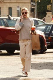 Emma Roberts in all beige as she grabs coffee in Los Angeles