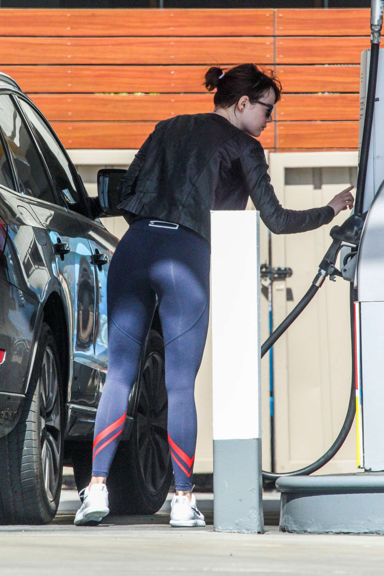 Emma Stone 2016 : Emma Stone in Tights pumping gas -08. 