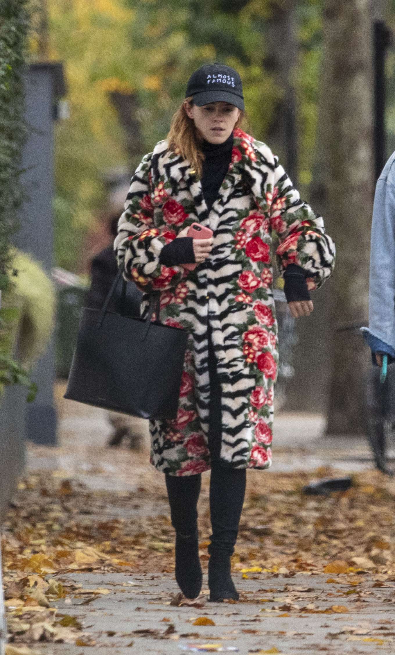 Emma Watson in a mixed print fur coat as she heads to pilates class in London