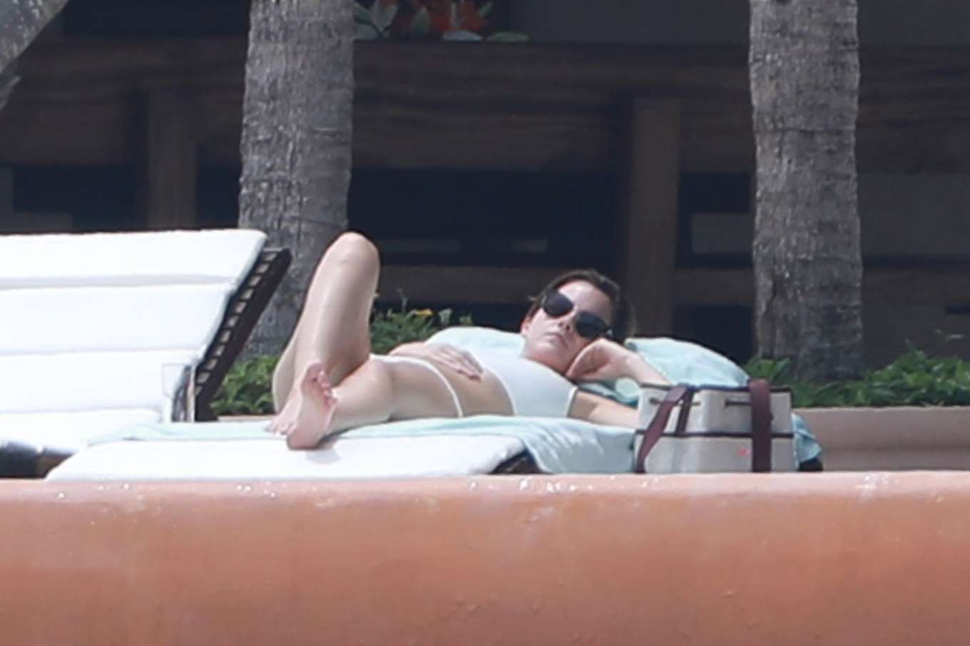 Emma Watson in White Bikini on the pool in Cabo San Lucas