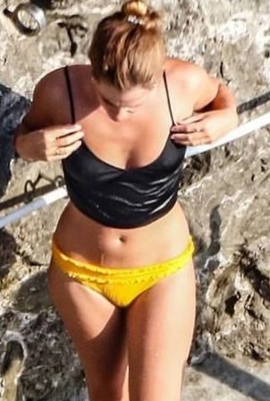 Emma Watson - In yellow bikini on holiday in Italy