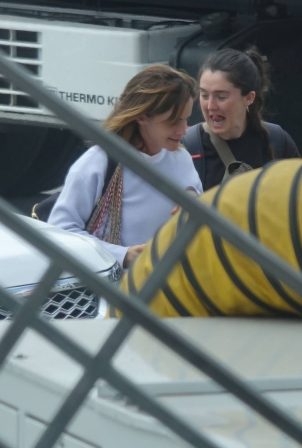 Emma Watson - Is spotted being escorted to a British Airways jet out of LAX