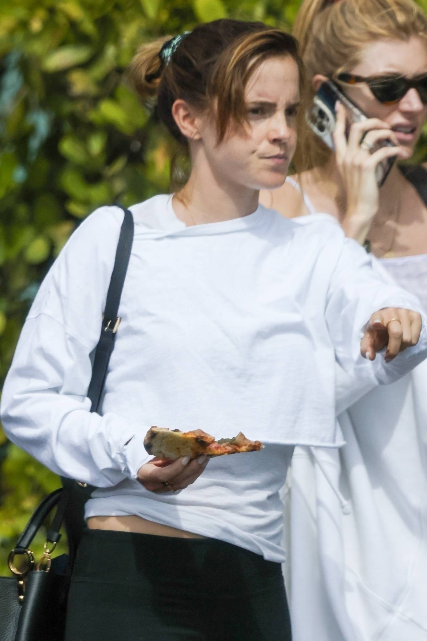 Emma Watson - Photographed enjoying her pizza on a stroll around the city