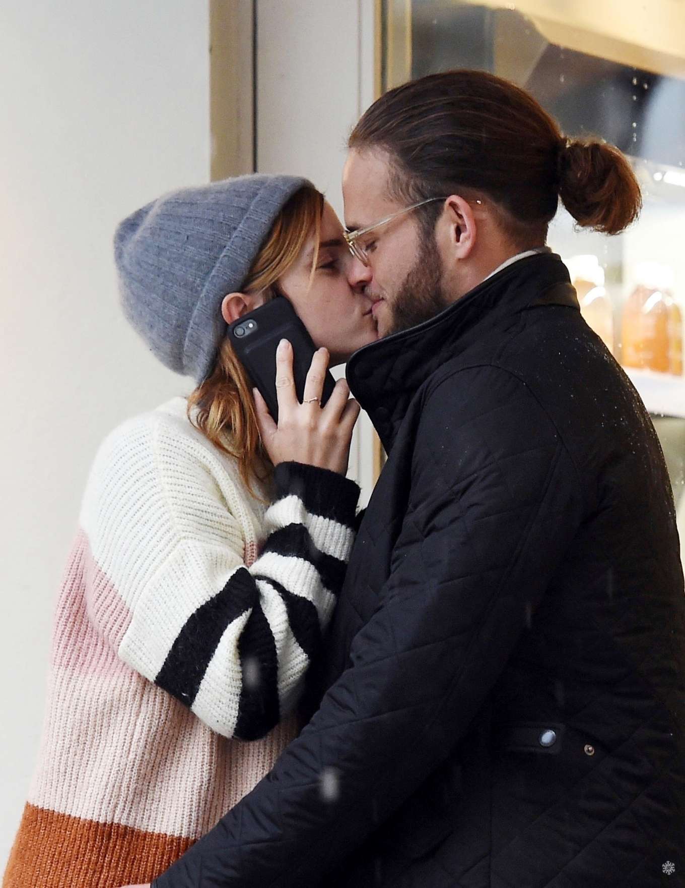 Emma Watson - Shares a kiss with mystery man in London