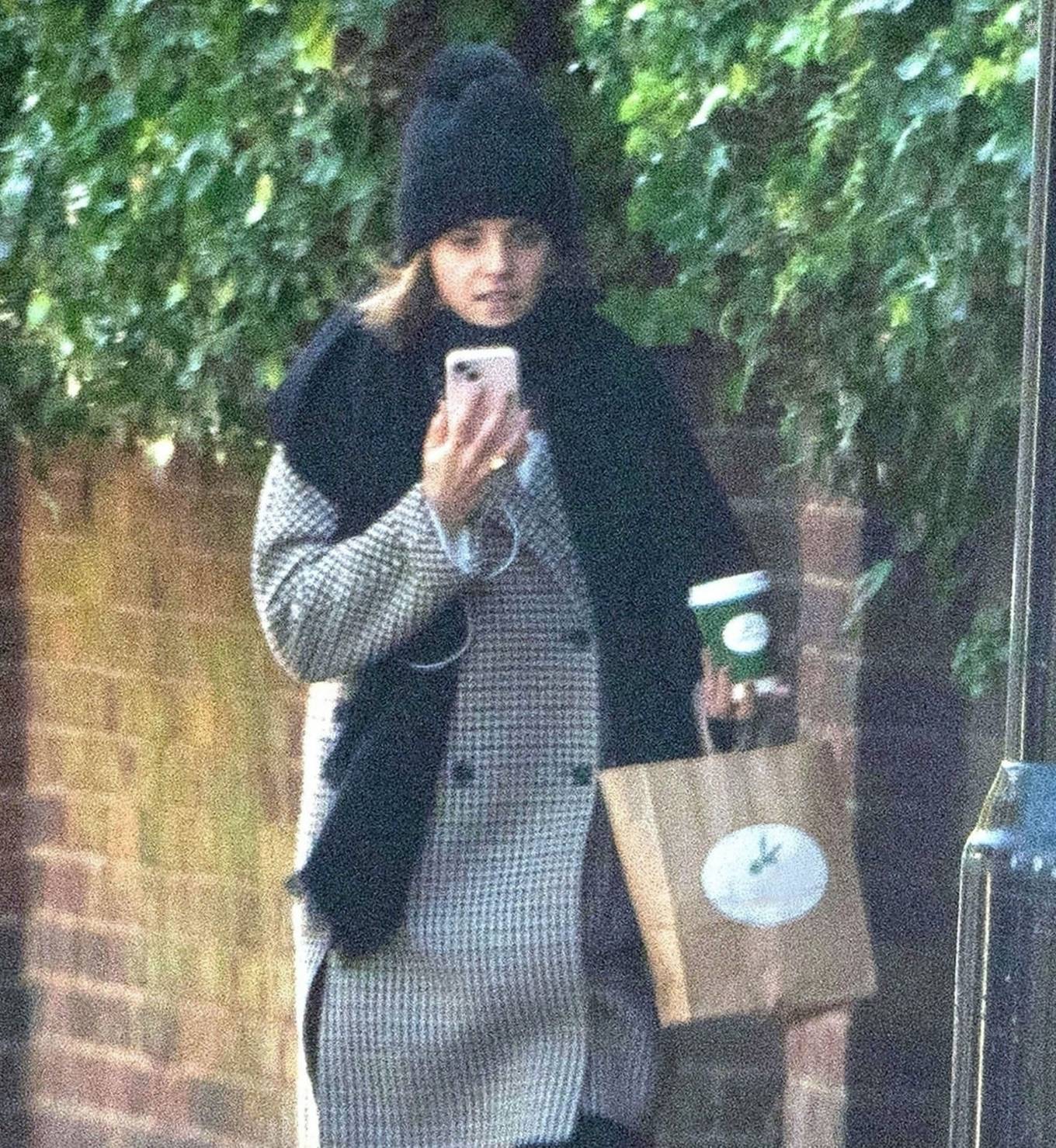 Emma Watson - Takes a Facetime call while out for a walk in London