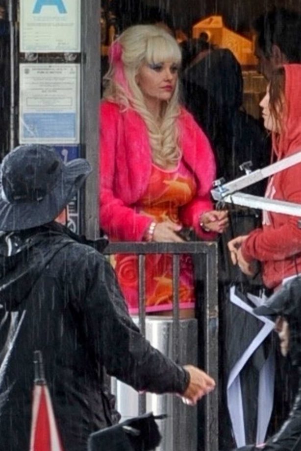 Emmy Rossum on the set of 'Angelyne' on a rainy day in LA