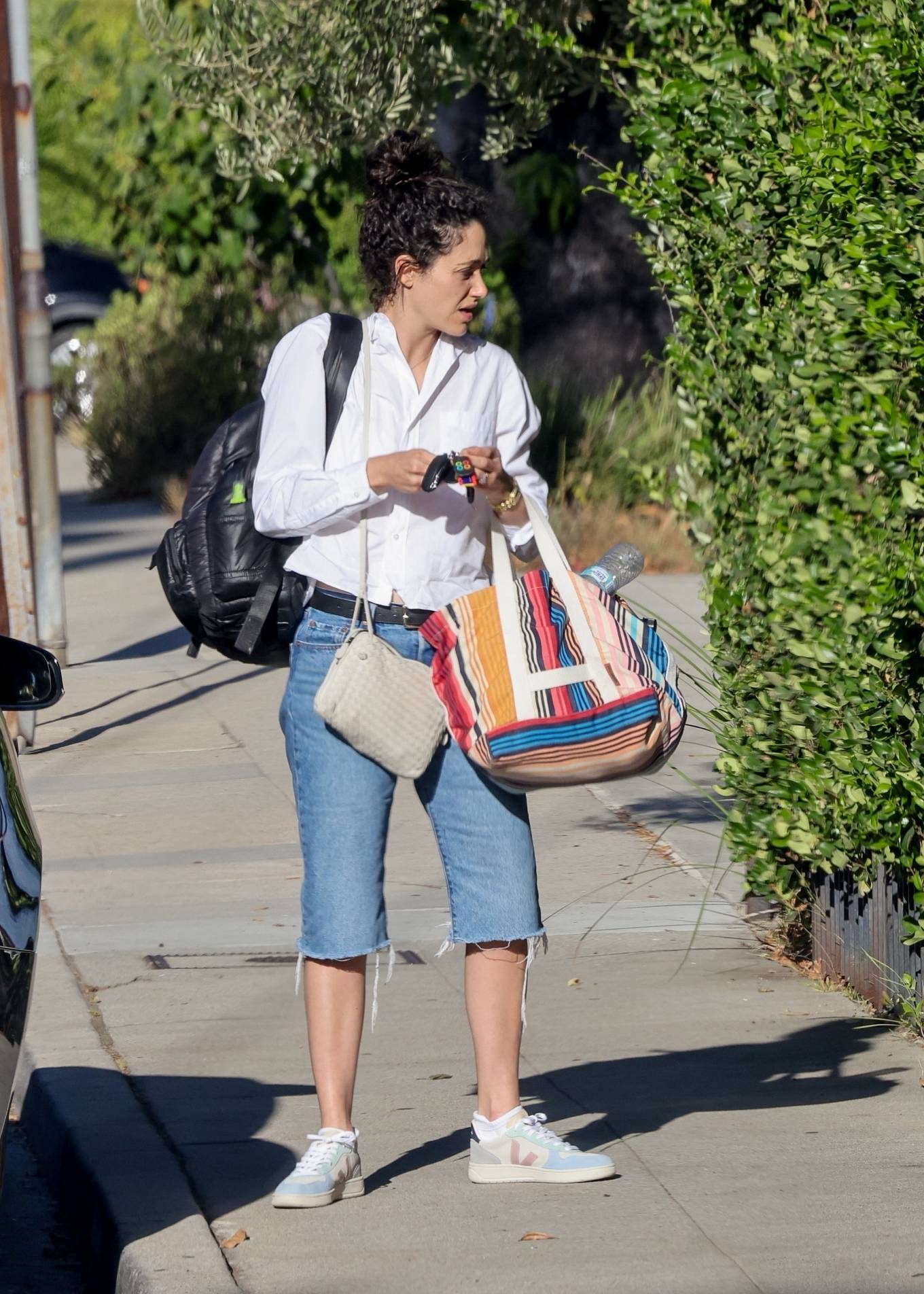 Emmy Rossum - Seen arriving at friends for a visit in Los Angeles