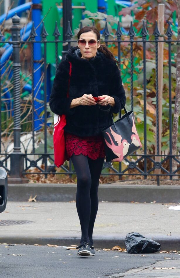 Famke Janssen - In a red mini skirt in Manhattan’s Downtown area