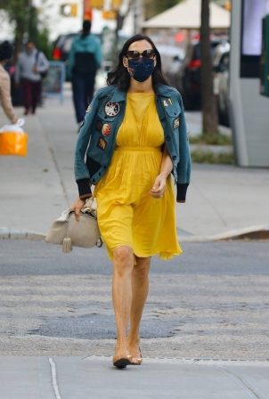 Famke Janssen - In a yellow dress and denim jacket out New York