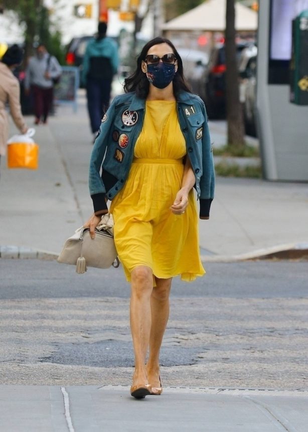 Famke Janssen - In a yellow dress and denim jacket out New York