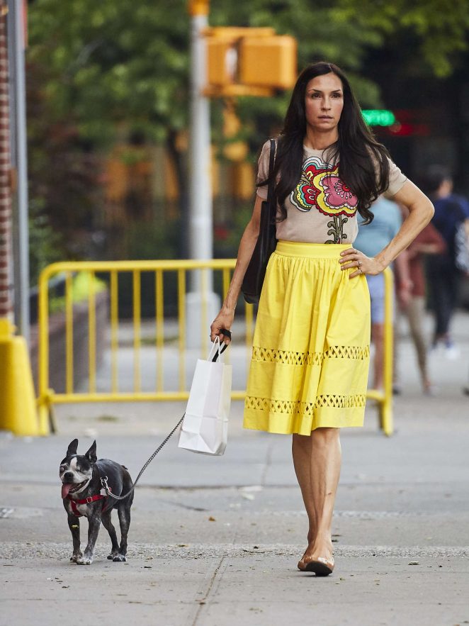 Famke Janssen in Yellow Skirt walking her dog in Soho