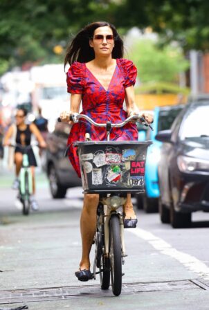 Famke Janssen - Wears colorful dress while out for a bike ride in New York
