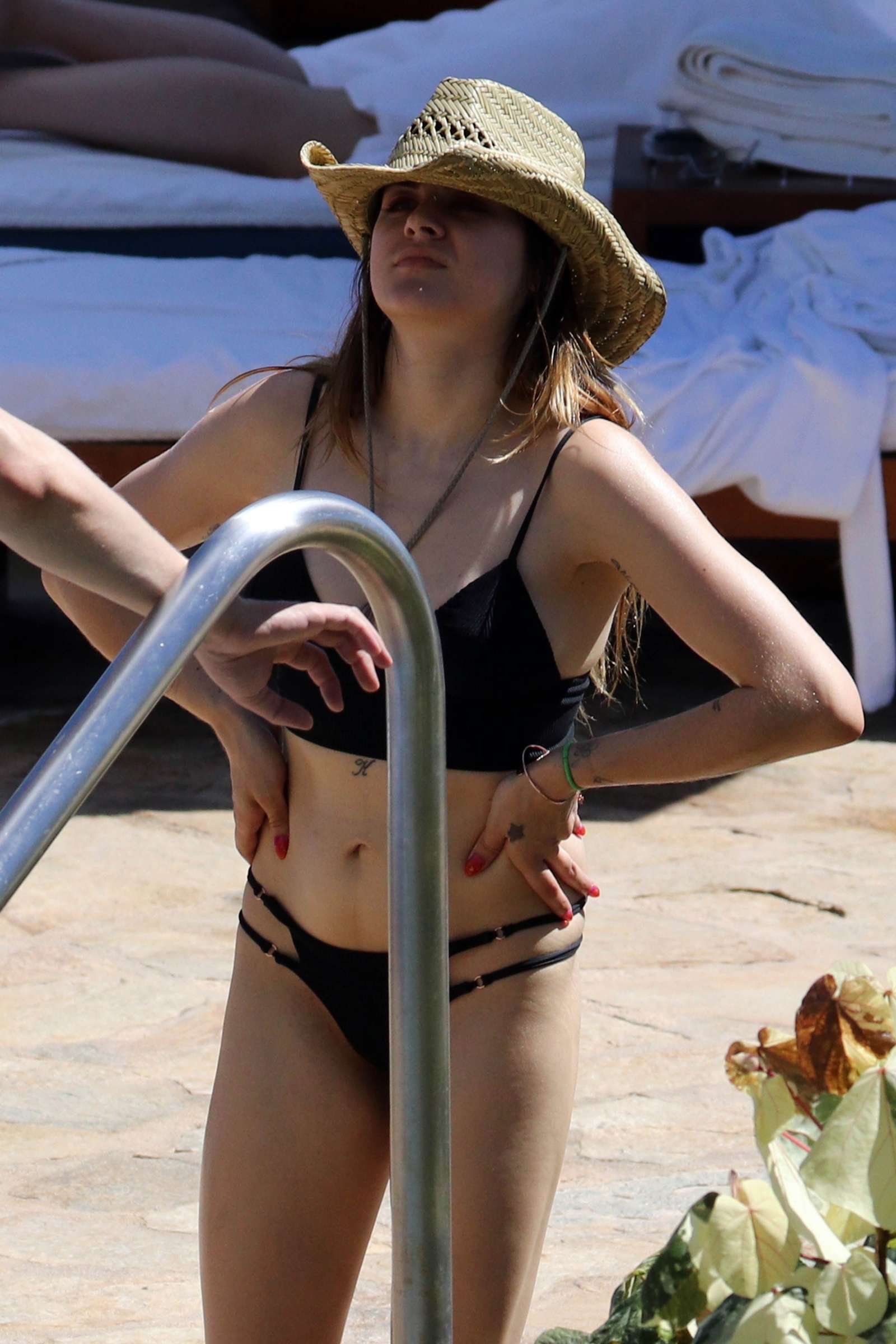 Frances Bean in Black Bikini on the pool in Hawaii. 