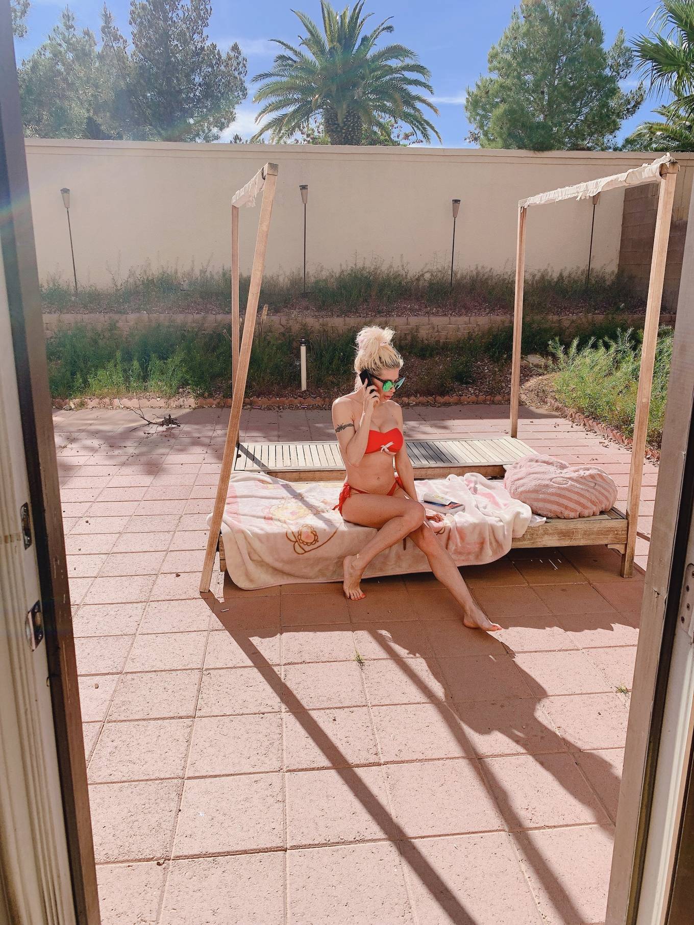 Frenchy Morgan â€“ Tanning in her garden in Las Vegas