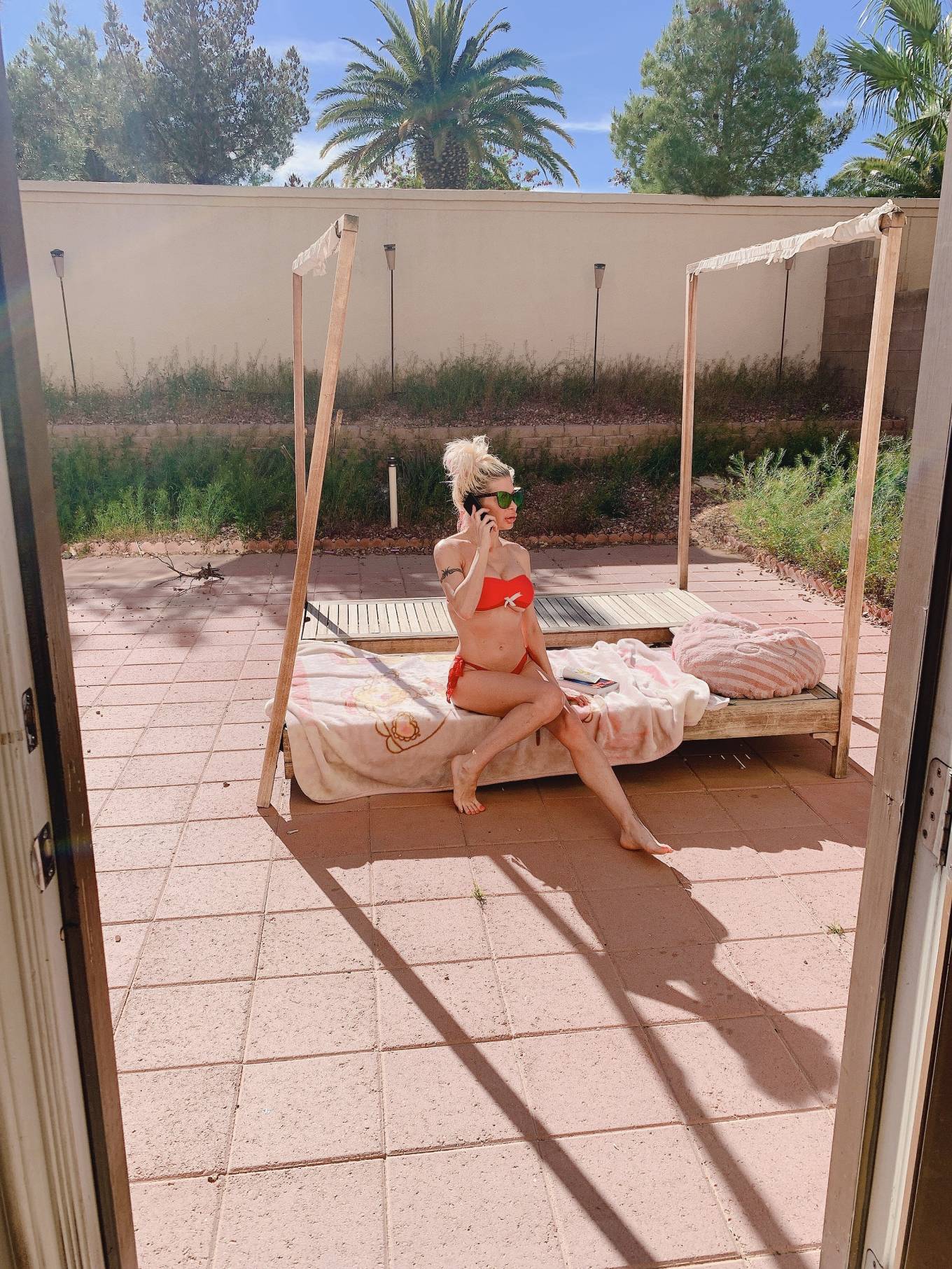 Frenchy Morgan â€“ Tanning in her garden in Las Vegas