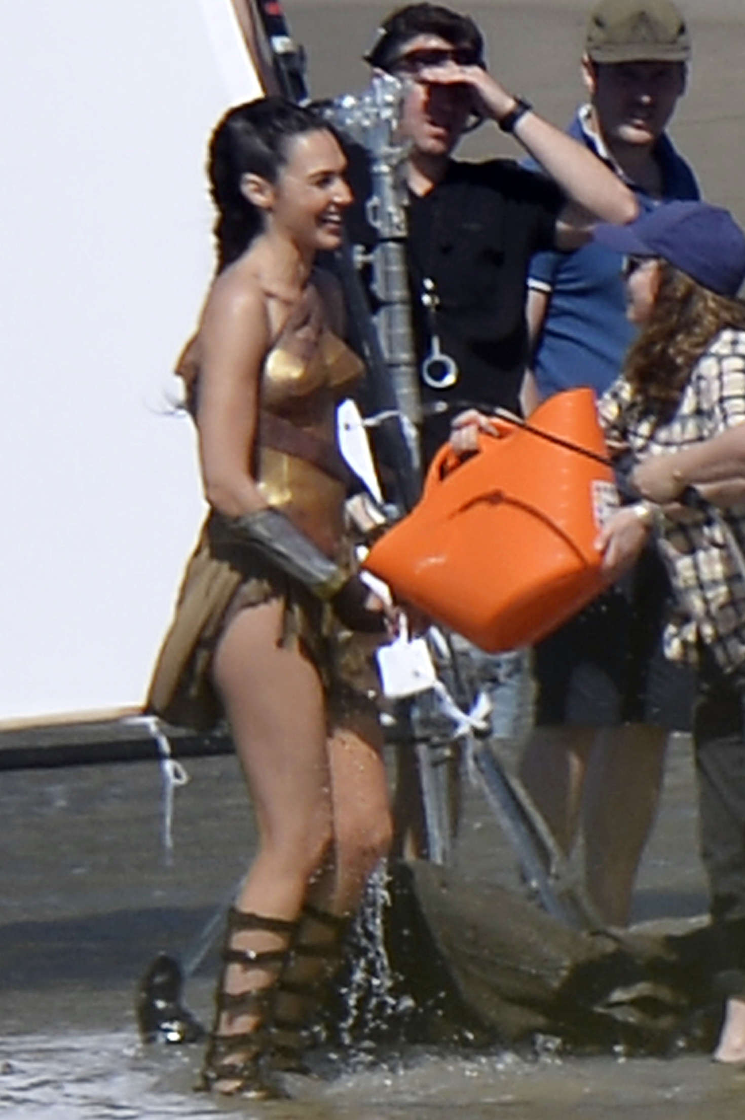 Gal Gadot On The Set Of Wonder Woman On The Beach In Italy Gotceleb Gadot is known for her role as gisele in the fast and the furious film series. gal gadot on the set of wonder woman