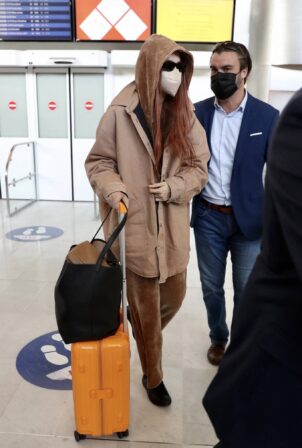 Gigi Hadid - Arrives at Paris-Charles de Gaulle Airport
