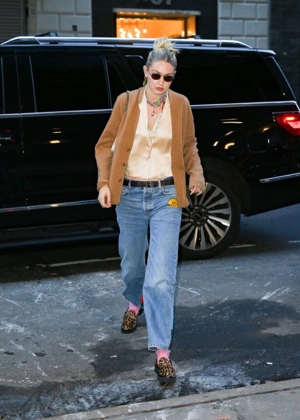 Gigi Hadid - in a brown sweater on the go in New York