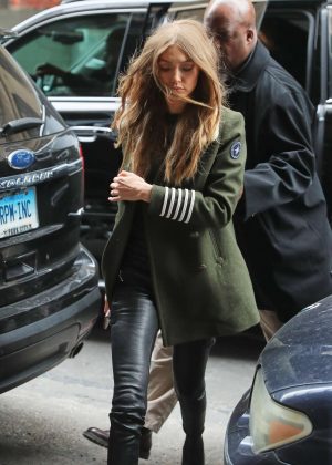 Gigi Hadid in green coat and leather pants in New York