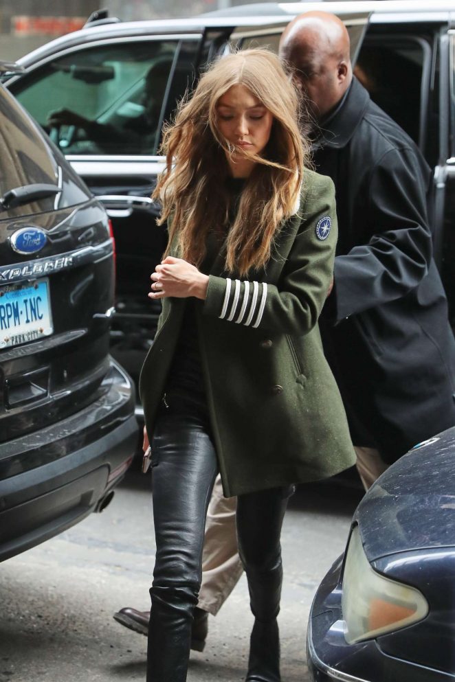 Gigi Hadid in green coat and leather pants in New York