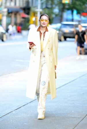 Gigi Hadid - Steps out in a white overcoat in New York