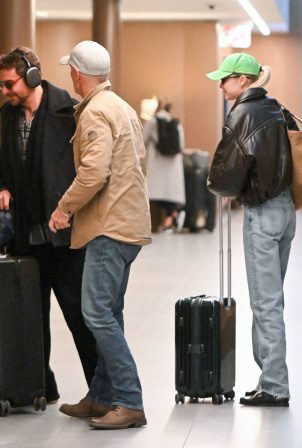 Gigi Hadid - With Bradley Cooper seen on rare outing at an airport in New York