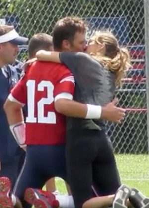 Gisele Bundchen and Tom Brady - Share a kiss in Foxborough