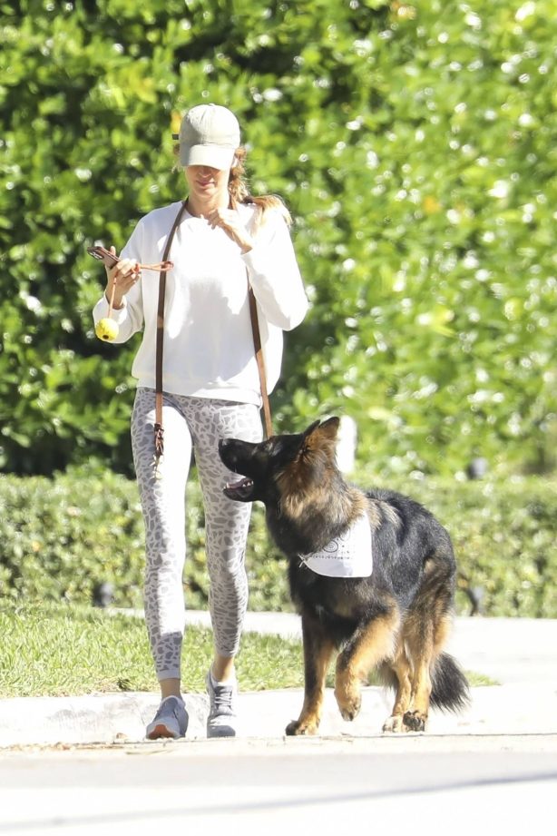 Gisele Bundchen - On a dog walk in Miami