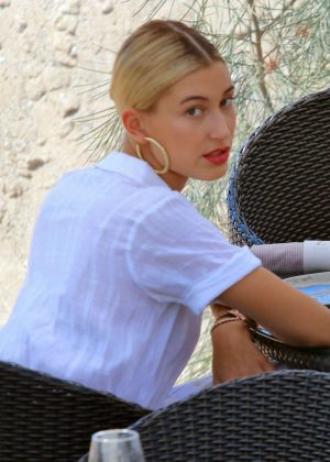 Hailey Baldwin having a drink at a bar in Cannes