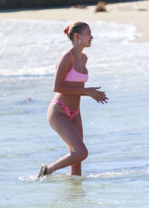 Hailey Baldwin in Pink Bikini on the beach in Laguna Beach