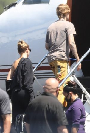 Hailey Bieber and Justin Bieber - Seen boarding a jet in Los Angeles