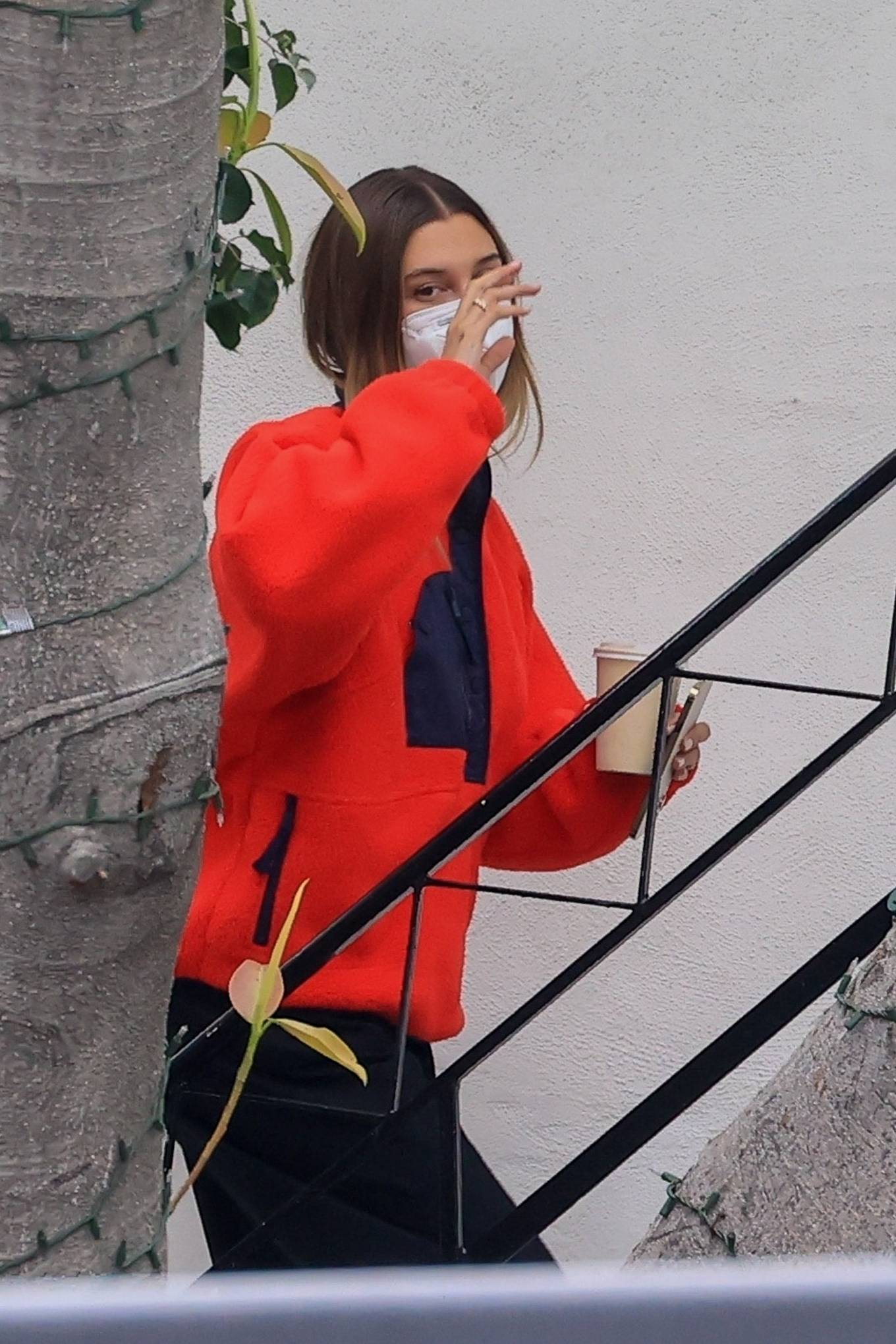 Hailey Bieber - In a red sweater out in Los Angeles