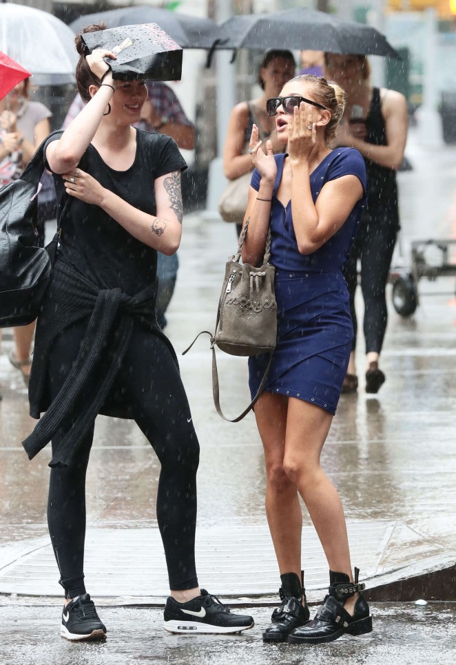 Hailey and Ireland Baldwin on a Rain in NYC