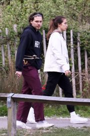 Hana Cross and Brooklyn Beckham take their dogs on a walk in London