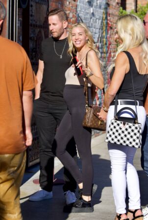 Heather Rae El Moussa - Holds hands with Tarek El Mousa as they arrive at T...